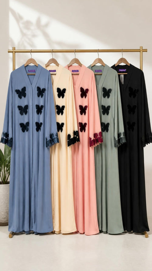 Ama Stone Butterfly Abaya in multiple colours displayed on hangers